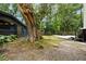 Beautiful backyard featuring a charming outbuilding with a swing, perfect for relaxation at 1515 N Lakeshore Dr, Mount Pleasant, SC 29466