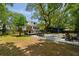 Beautiful backyard featuring a spacious patio with outdoor seating and a charming outbuilding at 1515 N Lakeshore Dr, Mount Pleasant, SC 29466