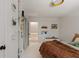 Bedroom boasts a white wall with black dots, stylish built-in shelves, and access to an upper level at 1515 N Lakeshore Dr, Mount Pleasant, SC 29466