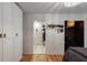 Bright bedroom features a closet, a walk-in closet and an office, hardwood floors, and white walls at 1515 N Lakeshore Dr, Mount Pleasant, SC 29466