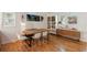 Dining room with hardwood floors, modern furniture, and ample natural light from the windows at 1515 N Lakeshore Dr, Mount Pleasant, SC 29466