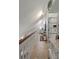 Bright hallway with white railing, white shelving, and a small window that allows natural light in at 1515 N Lakeshore Dr, Mount Pleasant, SC 29466