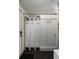 Hallway with lockers, coat racks, sliding door leading to laundry room at 1515 N Lakeshore Dr, Mount Pleasant, SC 29466