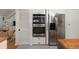 Modern kitchen with stainless steel refrigerator, double oven, and hidden storage at 1515 N Lakeshore Dr, Mount Pleasant, SC 29466