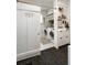 Well-lit laundry room with modern washer, dryer, and storage at 1515 N Lakeshore Dr, Mount Pleasant, SC 29466