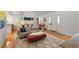 Bright living room with hardwood floors and neutral-toned furnishings complemented by a decorative area rug at 1515 N Lakeshore Dr, Mount Pleasant, SC 29466