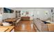 Open-concept living and dining area featuring hardwood floors and stylish decor and front door access at 1515 N Lakeshore Dr, Mount Pleasant, SC 29466