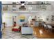 Bright, open-concept living room with vaulted ceilings, hardwood floors, and stylish contemporary furnishings at 1515 N Lakeshore Dr, Mount Pleasant, SC 29466