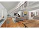 Spacious, airy living room with vaulted ceilings and abundant natural light highlighting the hardwood floors at 1515 N Lakeshore Dr, Mount Pleasant, SC 29466