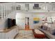 Well-lit living room with hardwood floors, modern furnishings, and a cozy loft space above at 1515 N Lakeshore Dr, Mount Pleasant, SC 29466