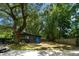 Charming outbuilding set amidst mature trees with a swing, offering a private retreat at 1515 N Lakeshore Dr, Mount Pleasant, SC 29466