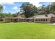 Expansive backyard featuring a gazebo, a workshop building, and lush green lawn at 1551 Hutton Pl, Charleston, SC 29407