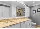 Bathroom with double sinks, granite countertops, and a view of the glass shower in the mirror at 1551 Hutton Pl, Charleston, SC 29407