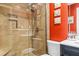 Tiled bathroom with a glass shower enclosure, built-in shelf, and dual shower heads at 1551 Hutton Pl, Charleston, SC 29407