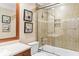 Bathroom featuring a tiled shower with glass doors, toilet, and granite vanity at 1551 Hutton Pl, Charleston, SC 29407
