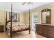 Traditional style bedroom with four poster bed, hardwood floors, and wooden dresser at 1551 Hutton Pl, Charleston, SC 29407