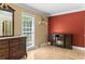 Bright bedroom with a large window, fireplace, hardwood floors, and classic furniture at 1551 Hutton Pl, Charleston, SC 29407
