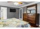 Bedroom featuring hardwood floors, ceiling fan, and a large chest of drawers at 1551 Hutton Pl, Charleston, SC 29407