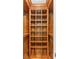 Custom closet design with wood shelving, compartments and hanging rods at 1551 Hutton Pl, Charleston, SC 29407