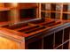 Close up of a custom built wooden closet island with open storage at 1551 Hutton Pl, Charleston, SC 29407