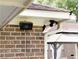 Exterior shot of Yamaha speakers and motion sensor lighting on a brick home near a gazebo at 1551 Hutton Pl, Charleston, SC 29407