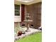 Charming fountain and lush landscaping accents the home's exterior and curb appeal at 1551 Hutton Pl, Charleston, SC 29407