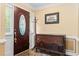 Foyer showcasing a decorative front door, tile floor, and an antique wooden dresser at 1551 Hutton Pl, Charleston, SC 29407