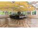 Finished garage with wood-look floors and cars, perfect for car enthusiasts or use as a workshop at 1551 Hutton Pl, Charleston, SC 29407