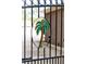 Close up of a palm tree design on a metal driveway gate at 1551 Hutton Pl, Charleston, SC 29407