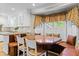 Eat in kitchen features a bay window, granite countertops, and an adjacent breakfast nook at 1551 Hutton Pl, Charleston, SC 29407