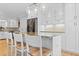 Bright, open kitchen featuring a large island with seating and modern pendant lighting at 1551 Hutton Pl, Charleston, SC 29407