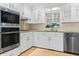 Well-equipped kitchen with stainless steel appliances and white cabinets at 1551 Hutton Pl, Charleston, SC 29407