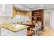 Eat in kitchen features a bay window and dark wood built in shelving with seating at 1551 Hutton Pl, Charleston, SC 29407