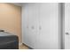 Laundry room has abundant storage cabinets and modern washer and dryer at 1551 Hutton Pl, Charleston, SC 29407