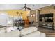 Bright living room with brick accents, a mounted TV, and access to a sunroom with a brick wall at 1551 Hutton Pl, Charleston, SC 29407