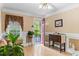 Bright and airy living room with view of front door, hardwood floors, and traditional decor at 1551 Hutton Pl, Charleston, SC 29407