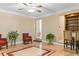 Bright living room with hardwood floors, decorative chairs, and built-in shelving at 1551 Hutton Pl, Charleston, SC 29407
