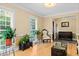Comfortable living room filled with plants and natural light from the large windows at 1551 Hutton Pl, Charleston, SC 29407