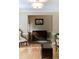 Living room featuring hardwood floors, light tan walls, a chest and white trim at 1551 Hutton Pl, Charleston, SC 29407