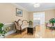 Open-concept living room with hardwood floors and an adjacent kitchen with bar seating at 1551 Hutton Pl, Charleston, SC 29407