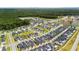 Aerial view of a Primary-planned community with mature trees and a serene pond at 1963 Longhorn Ln, Summerville, SC 29485