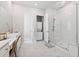 Bright bathroom with glass-enclosed shower, double vanity with a make up counter, and tile floors at 1963 Longhorn Ln, Summerville, SC 29485