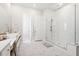 Bright bathroom with glass-enclosed shower, double vanity with a make up counter, and tile floors at 1963 Longhorn Ln, Summerville, SC 29485