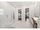 Bright bathroom with glass-enclosed shower, double vanity with make up counter, and a walk-in closet at 1963 Longhorn Ln, Summerville, SC 29485