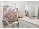 Bathroom with a colorful shower curtain, single vanity, and marble flooring at 1963 Longhorn Ln, Summerville, SC 29485