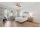 Bright bedroom with blue accents, a ceiling fan, and a desk by the window at 1963 Longhorn Ln, Summerville, SC 29485