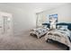 Bright bedroom features two twin beds, a window, and carpeted flooring at 1963 Longhorn Ln, Summerville, SC 29485