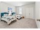 Bright bedroom with two twin beds, carpet, and natural light from window at 1963 Longhorn Ln, Summerville, SC 29485