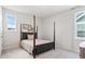 Bedroom featuring a four-poster bed, plush carpeting, and two windows for lots of natural light at 1963 Longhorn Ln, Summerville, SC 29485