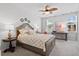 Relaxing bedroom featuring a large bed, ceiling fan, and natural light at 1963 Longhorn Ln, Summerville, SC 29485